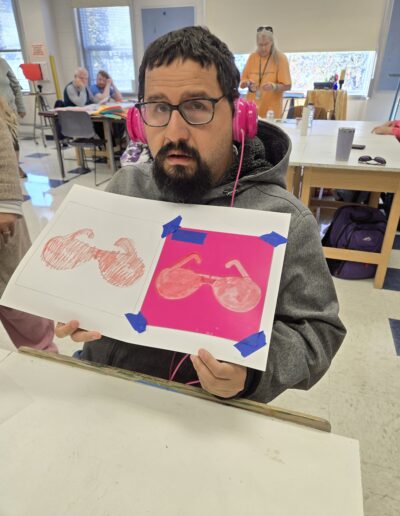 Tyler participates in a mixed media art class at Carroll Community College.